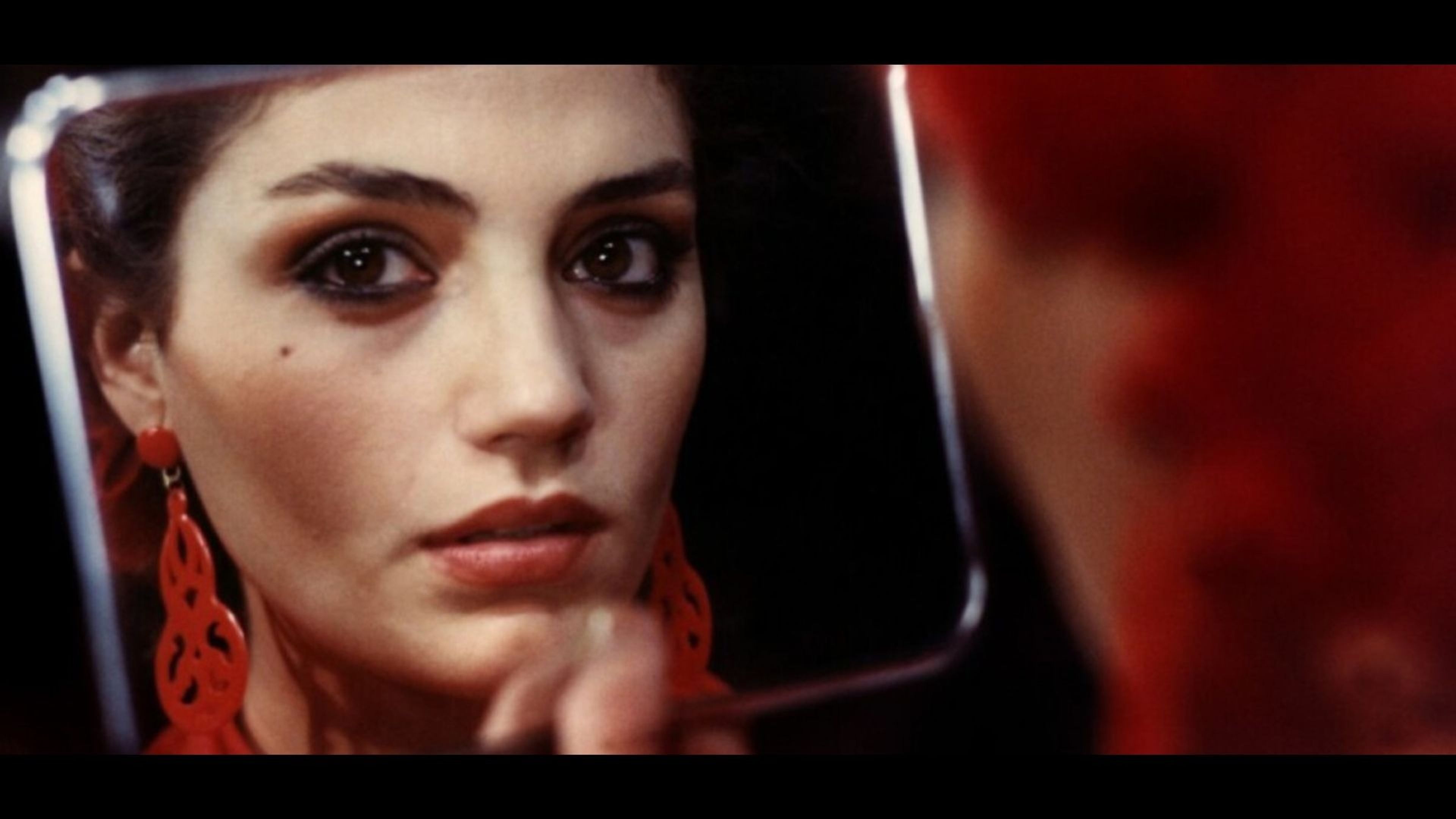 Promotiv grafikk for Film: Begjærets dunkle mål